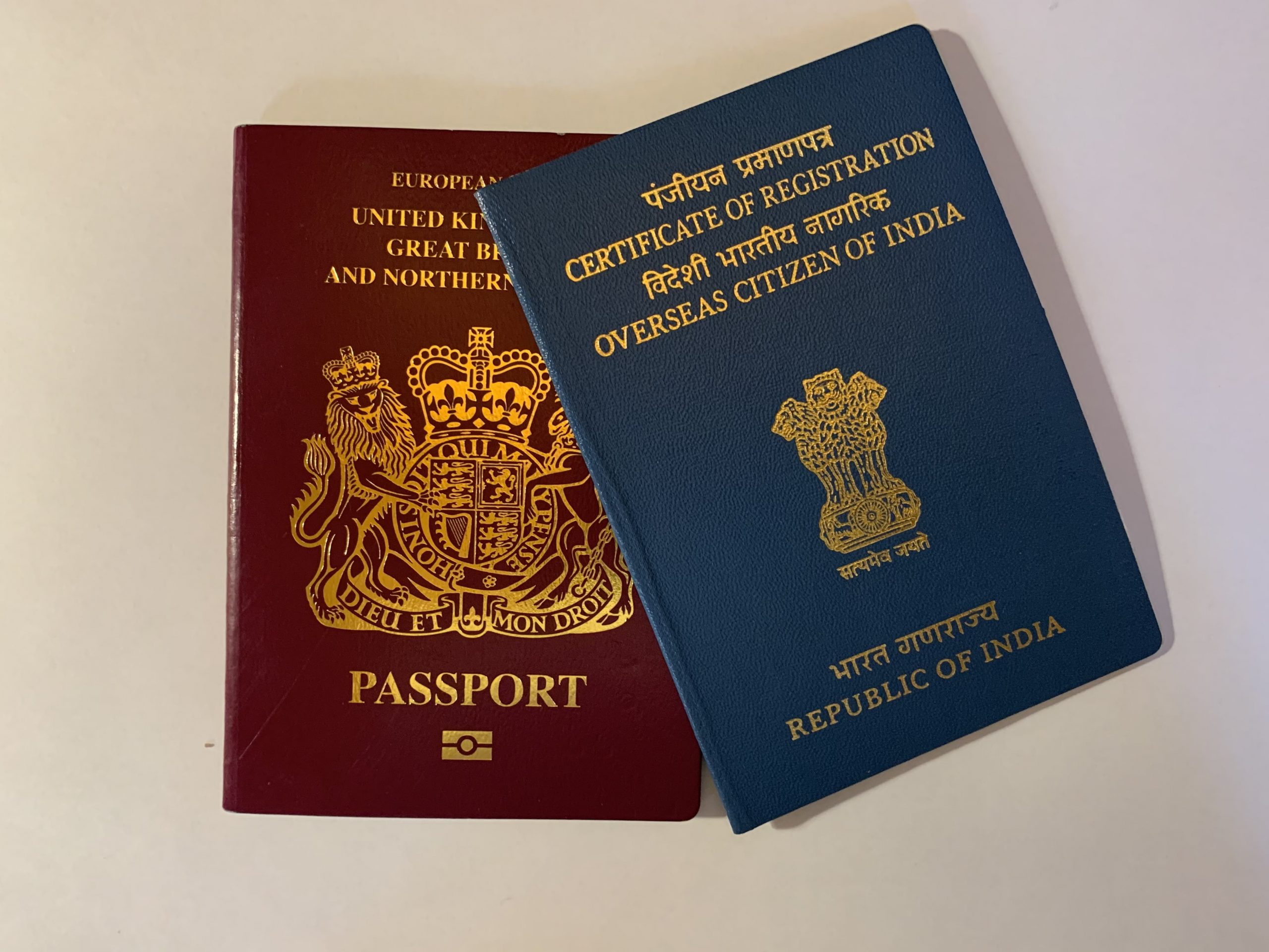 travelling to india with old oci and new passport