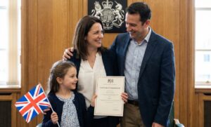Man, wife and child at british citizenship ceremony