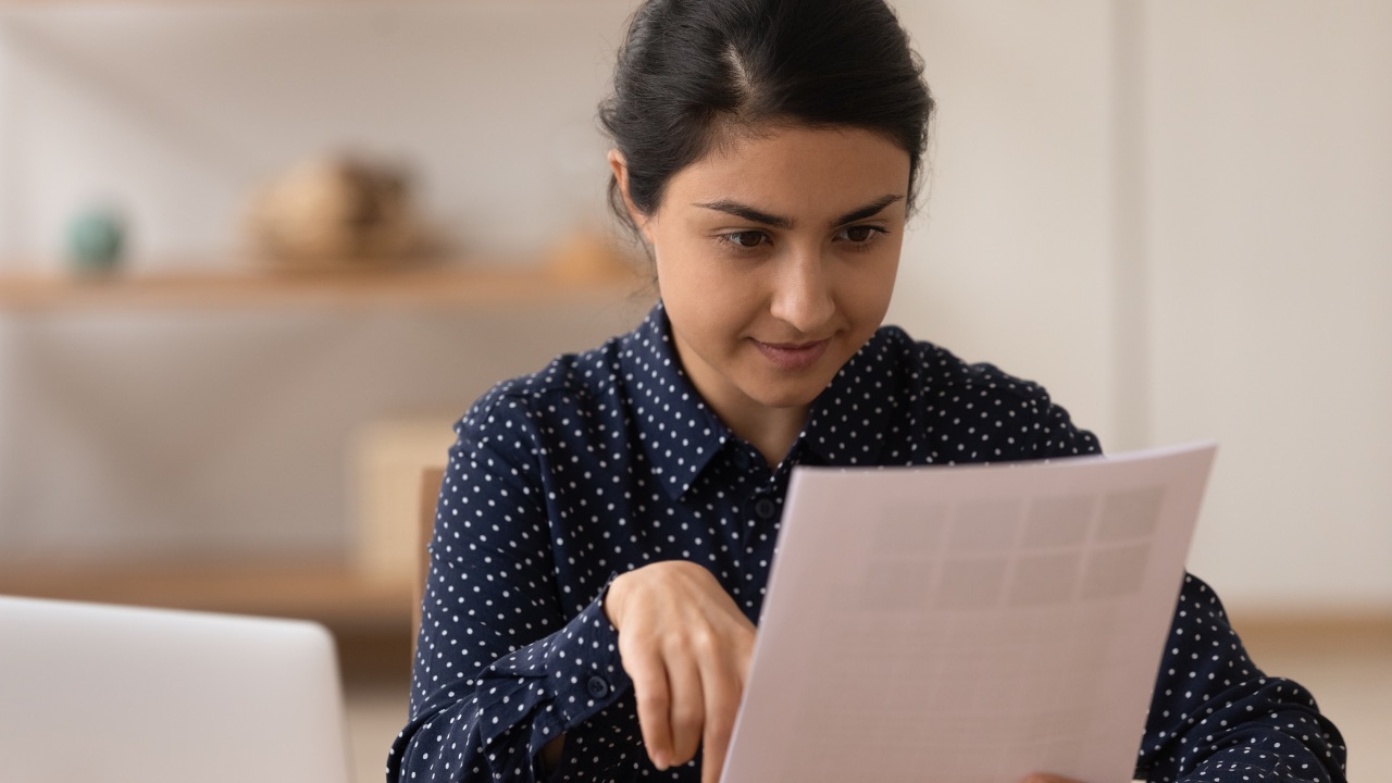 UK-based NRI client reviewing her Indian POA documents.
