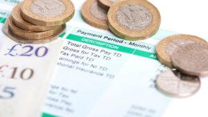 Payslip with cash and coins