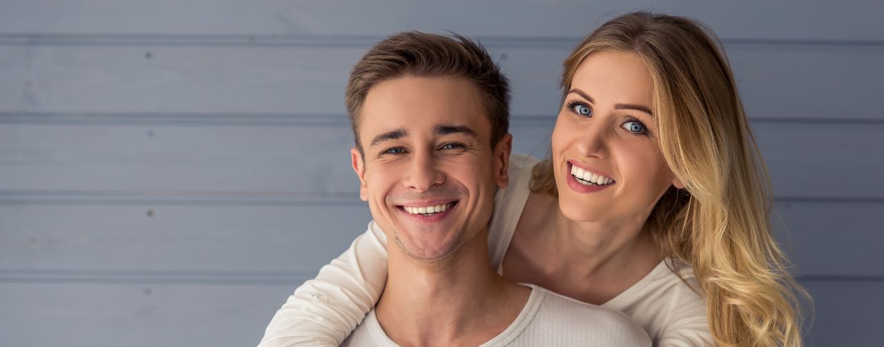 uk-spouse-visa-proof-of-relationship-documents-hero A happy couple embracing, illustrating proof of relationship documents for a UK spouse visa