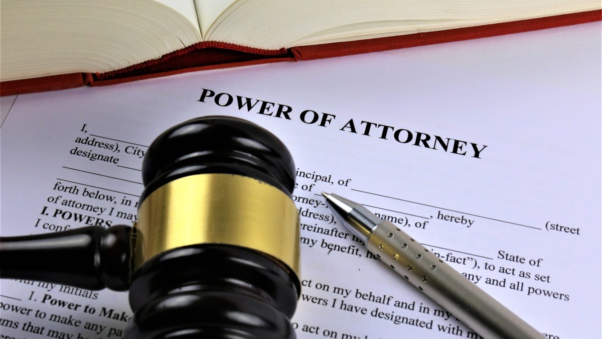 GPA versus SPA Gavel and pen resting on a power of attorney form, illustrating the difference between a general and special Indian Power of Attorney
